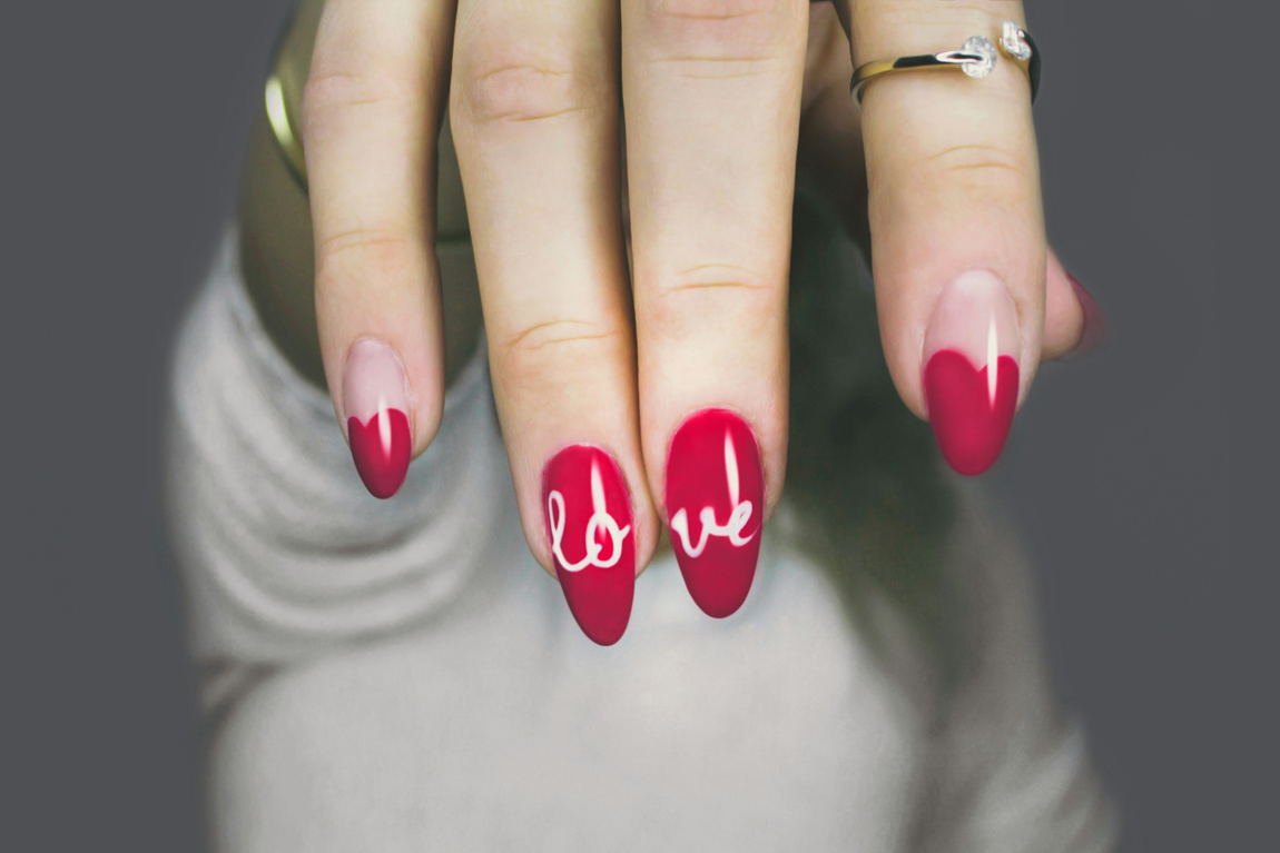 a hand with painted nails